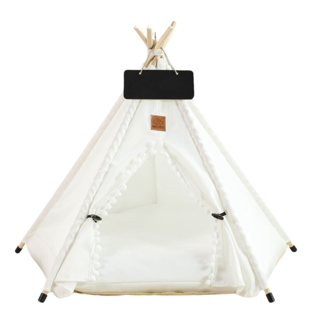 Creamy white dog tent bed with bali style bobbles featured around the entrance. Yurt/Teepee glamping style look. Chalk board above the door for dogs name. 