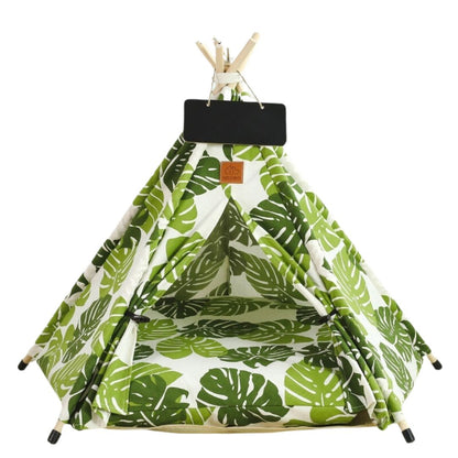  Yert or Teepee style dog tent bed with monstera leaf pattern. Chalk board above the door for dogs name. 