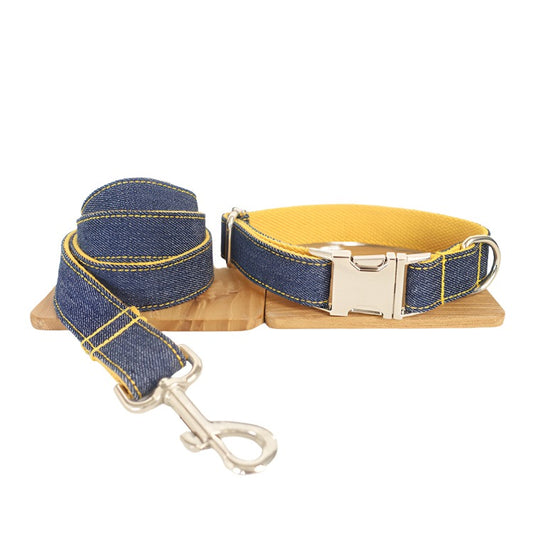 blue denim dog collar and leash set with silver hardware and yellow interior. Stylish and comfortable for dog walking